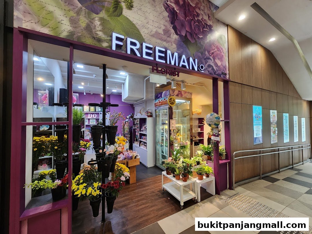 The exterior of Freeman Florist shop, showcasing a vibrant display of fresh flowers and plants.