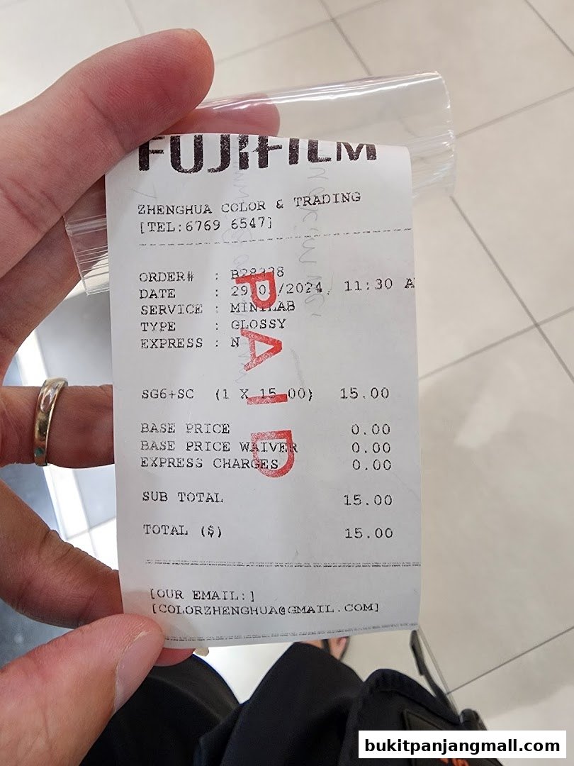 A receipt from Fujifilm's Zhenghua Color & Trading for a minilab service.