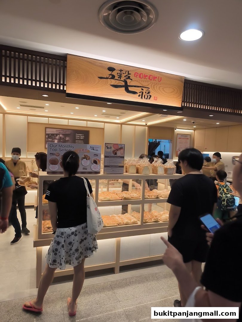 Customers browse a variety of fresh baked goods at Gokoku Japanese Bakery.