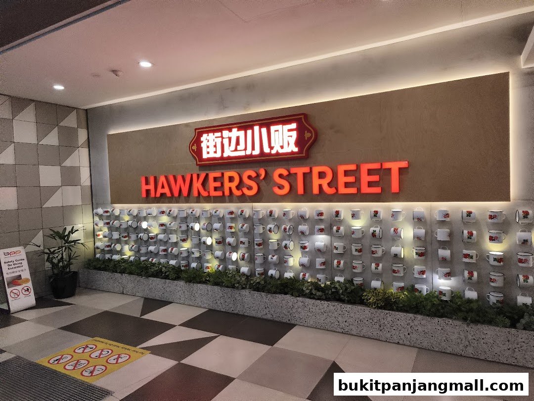 The entrance to Hawkers Street BPP, featuring a prominent sign and a wall decorated with numerous mugs.
