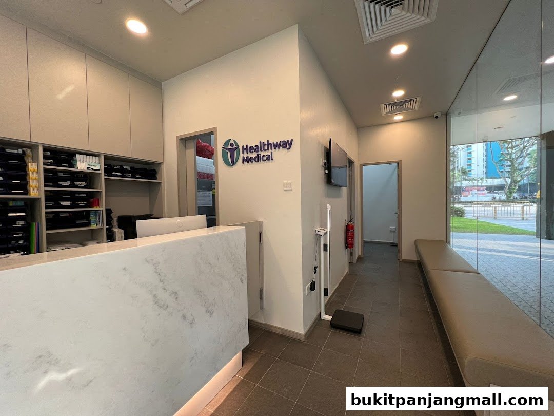 Interior view of Healthway Medical clinic reception area with a counter and waiting bench.