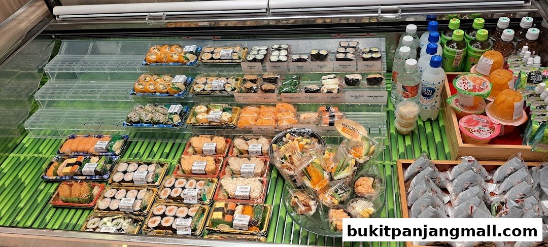 A display of various sushi rolls, bento boxes, and drinks in a refrigerated case.