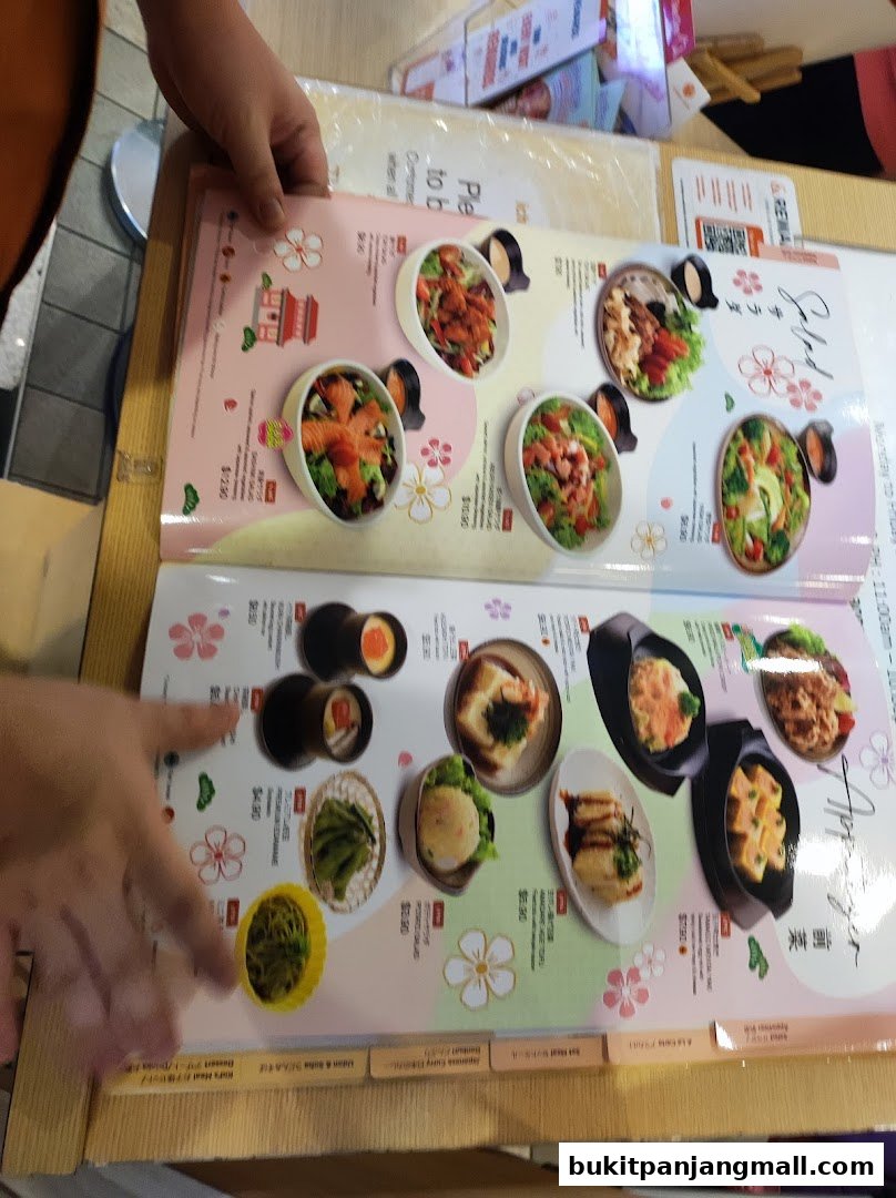 A menu from Ichiban Sushi Bukit Panjang showcasing various Japanese dishes with appealing visuals.