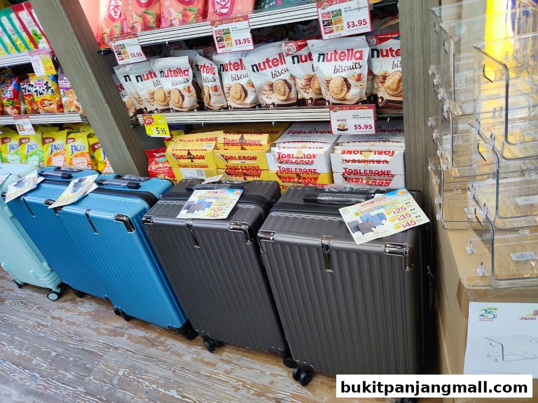 A display of luggage and snacks, including Toblerone and Nutella biscuits, at Japan Home.