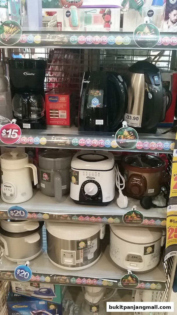 A display of kitchen appliances including coffee makers, rice cookers, and a deep fryer.