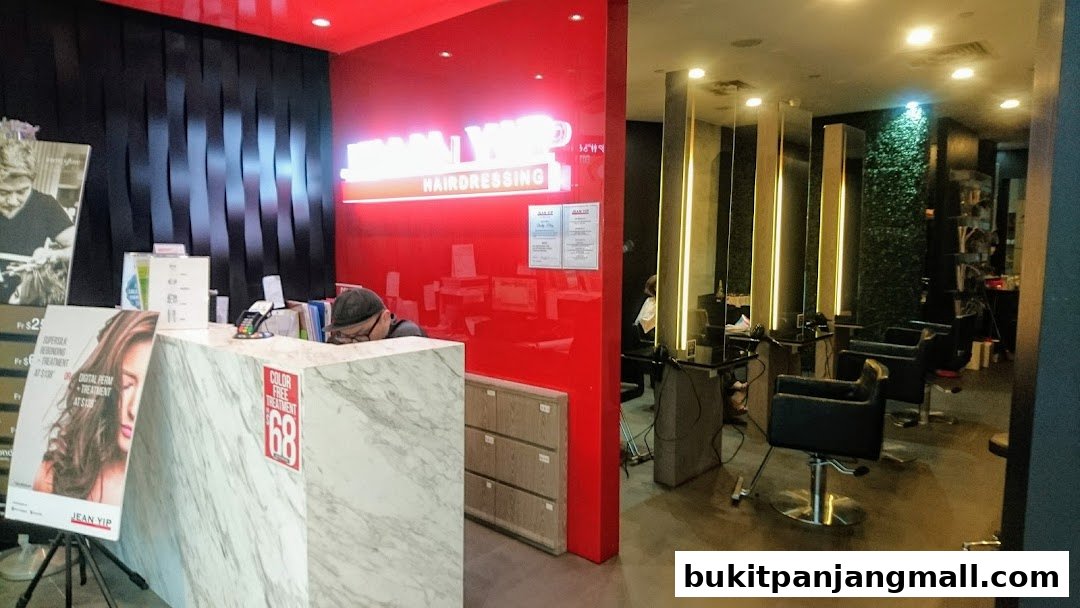 Interior view of Jean Yip Hairdressing & Beauty salon with reception and styling chairs.