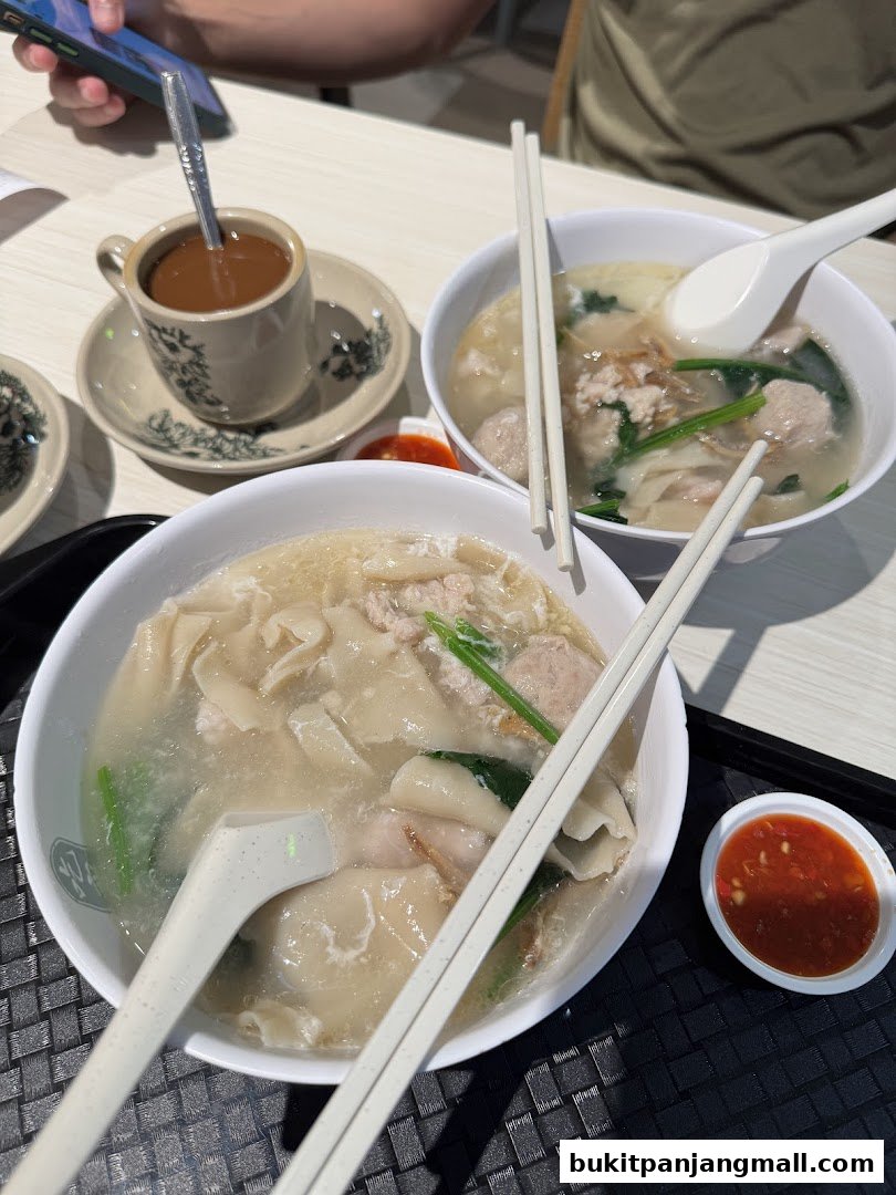 Two bowls of Mee Hoon Kway soup with meatballs and a cup of coffee.