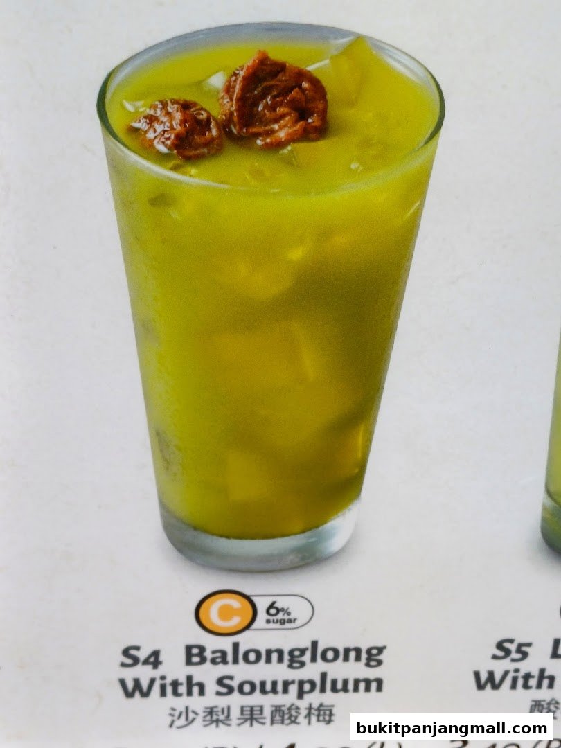 A refreshing green drink with two dried fruits on top, labeled as Balonglong With Sourplum.