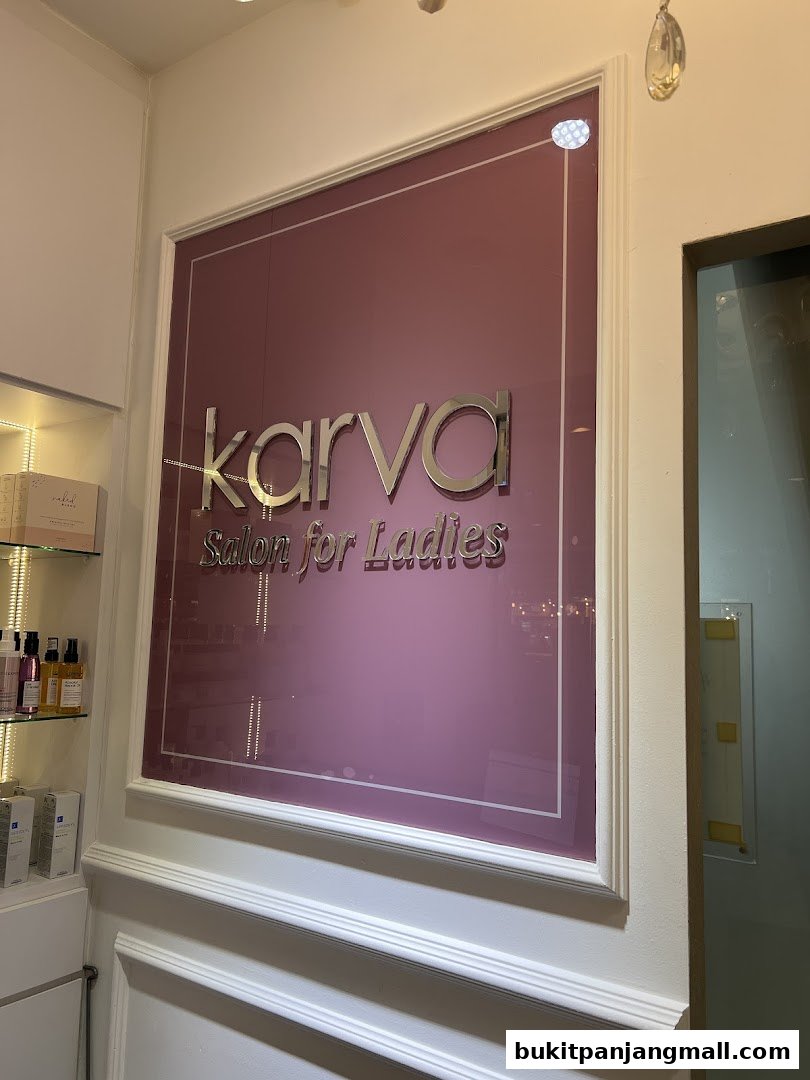 The entrance sign for KARVA Salon for Ladies, featuring a prominent logo and elegant design.