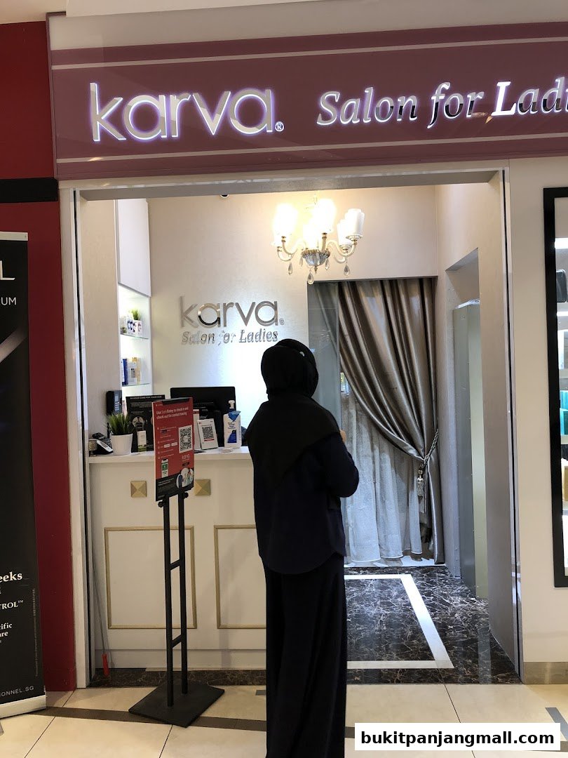 The entrance of Karva Salon for Ladies, a beauty salon, with a person standing inside.
