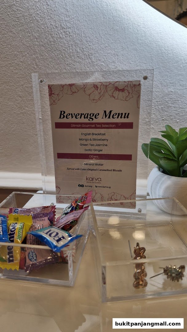 A beverage menu from KARVA Salon for Ladies, featuring Dilmah teas and mineral water.