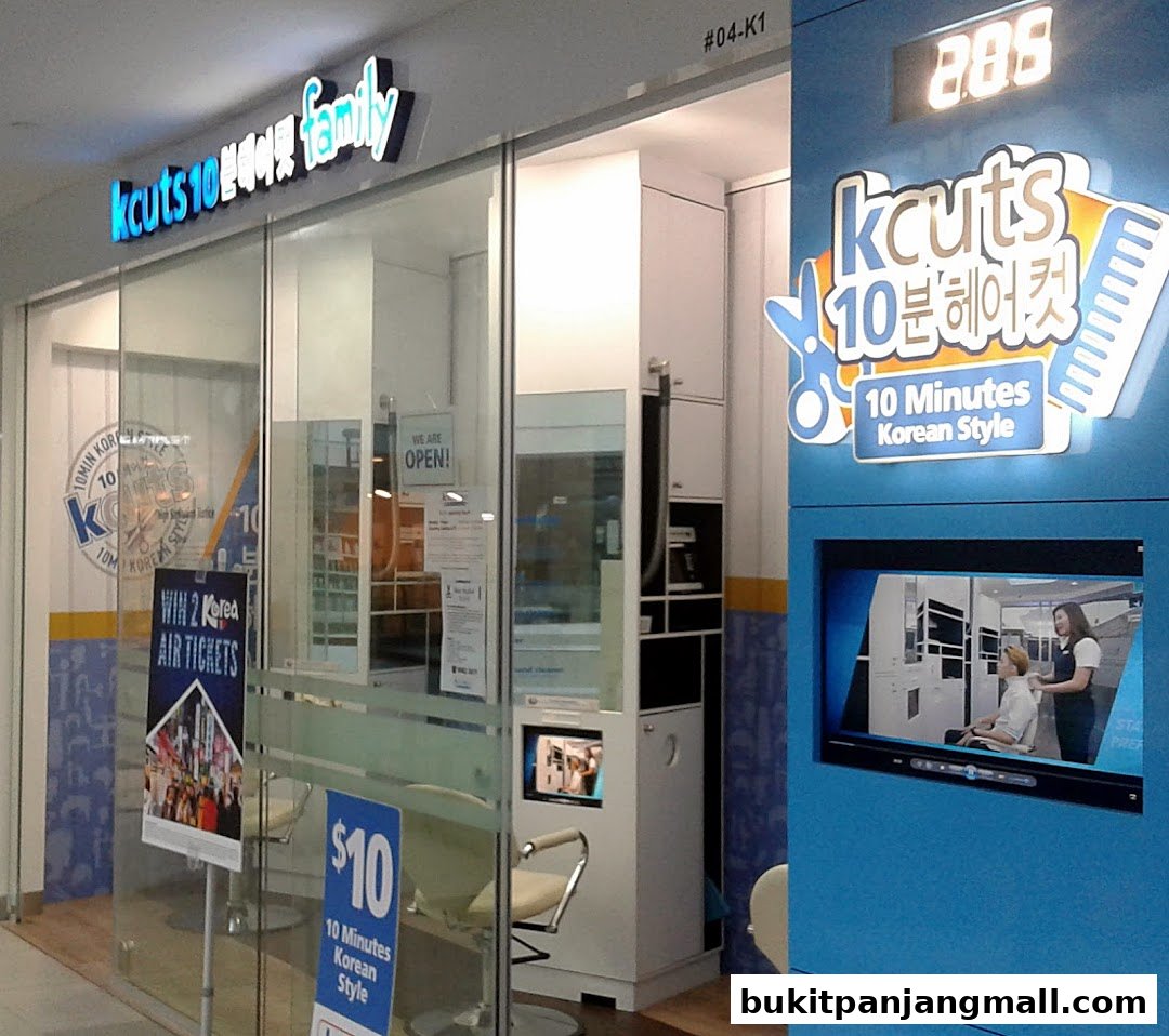The exterior of a Kcuts hair salon with a prominent sign and promotional displays.