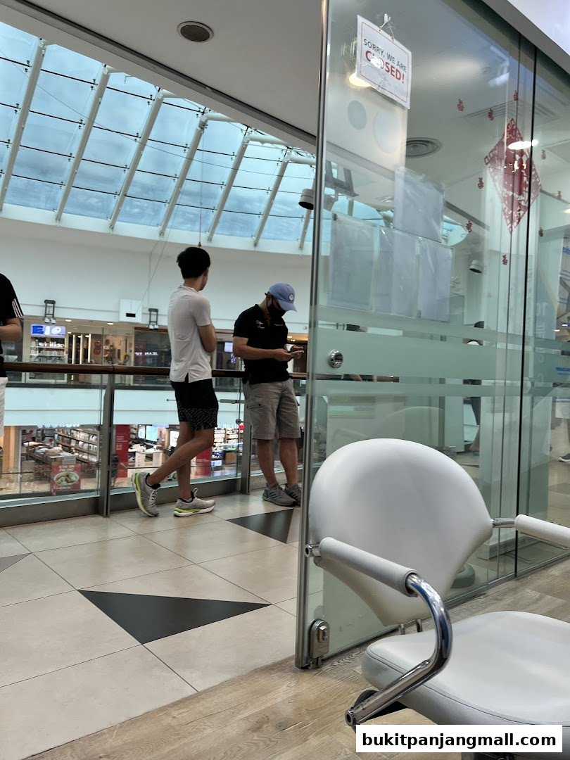 A hair salon with a 'Sorry, we are closed!' sign on the glass door.