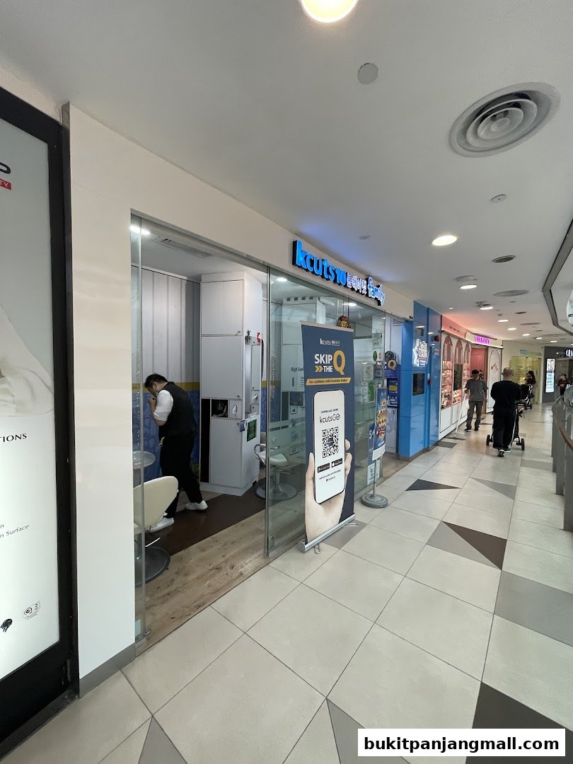 The entrance of a kcuts hair salon with a banner advertising skipping the queue.