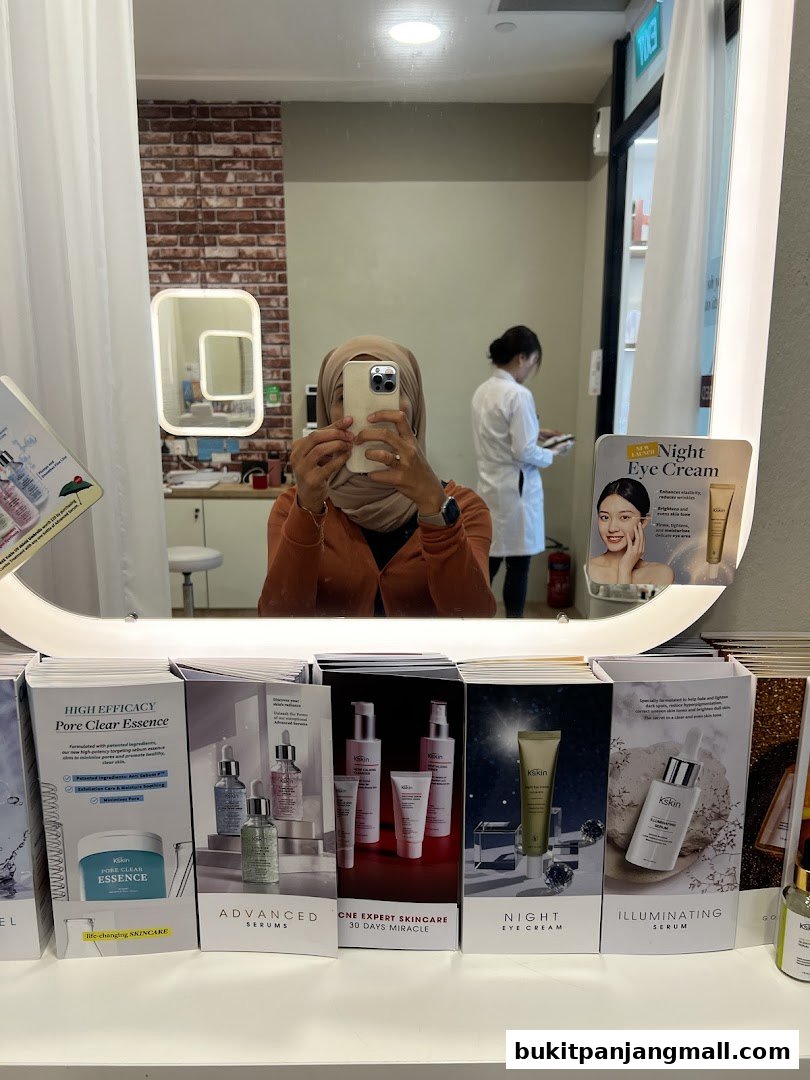 A display of Kskin skincare products, including serums and creams, in a retail setting.