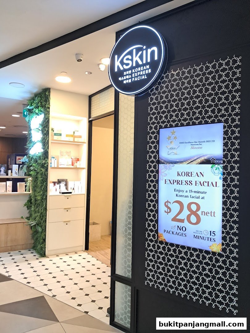 The entrance of Kskin Korean Express Facial shop with a glowing sign and promotional display.