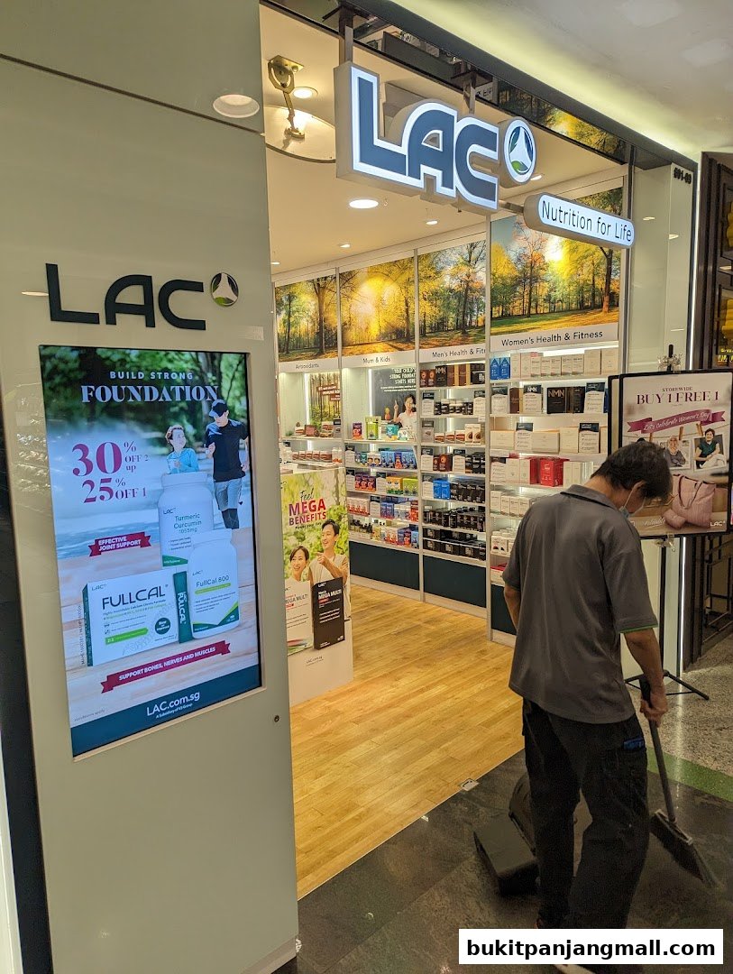 The entrance of LAC Nutrition For Life store with promotional displays and products inside.