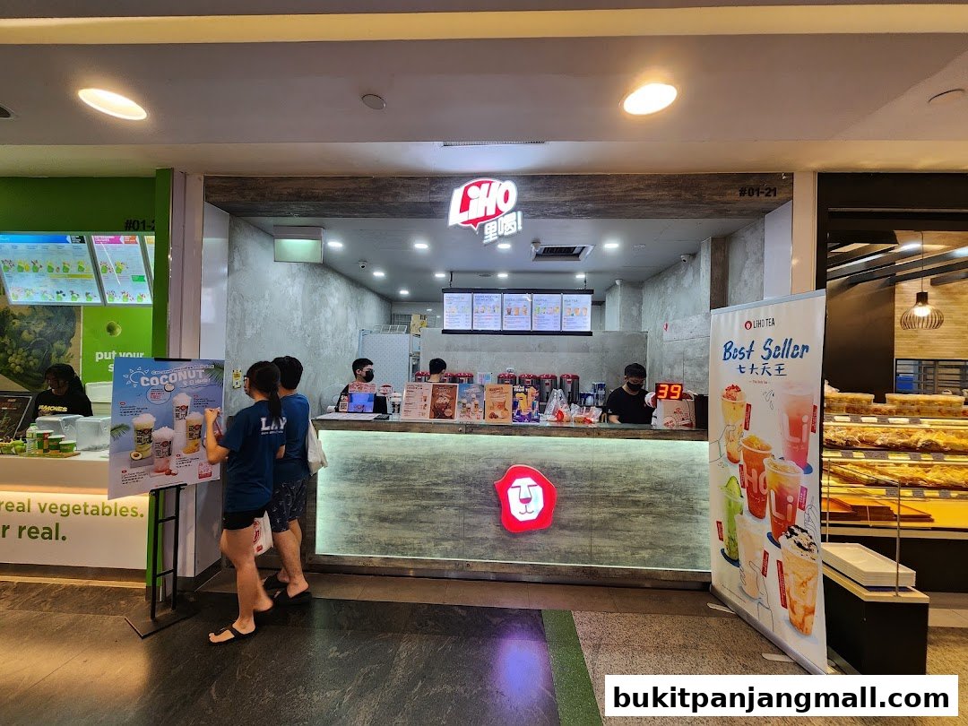 LiHO TEA shop with staff serving customers and promotional displays.