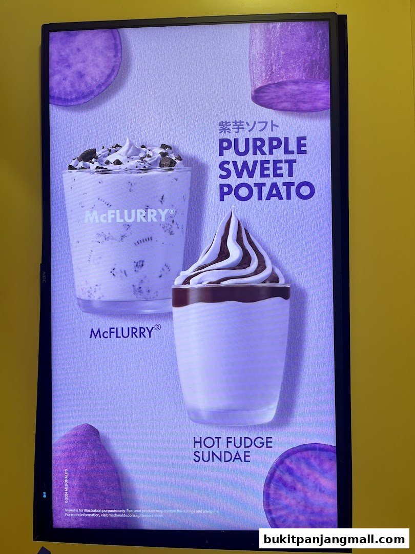 A digital menu board showcasing McDonald's McFlurry and Hot Fudge Sundae desserts.
