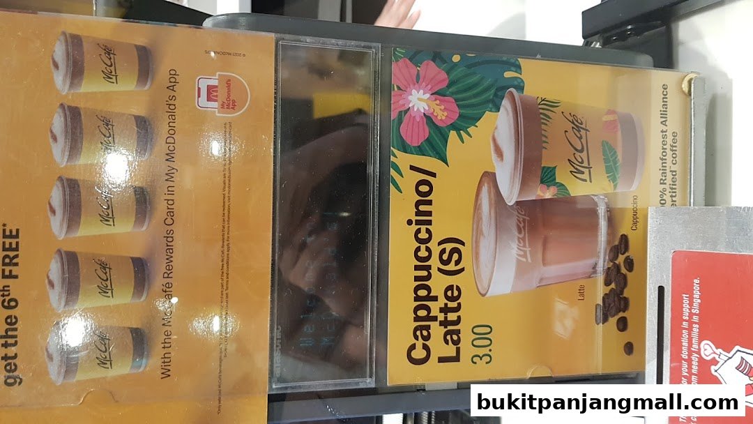 A display showing McCafe drinks and a promotion for a rewards card.