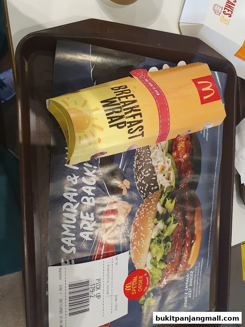 A McDonald's tray with a breakfast wrap and a Double Samurai Beef Burger meal.