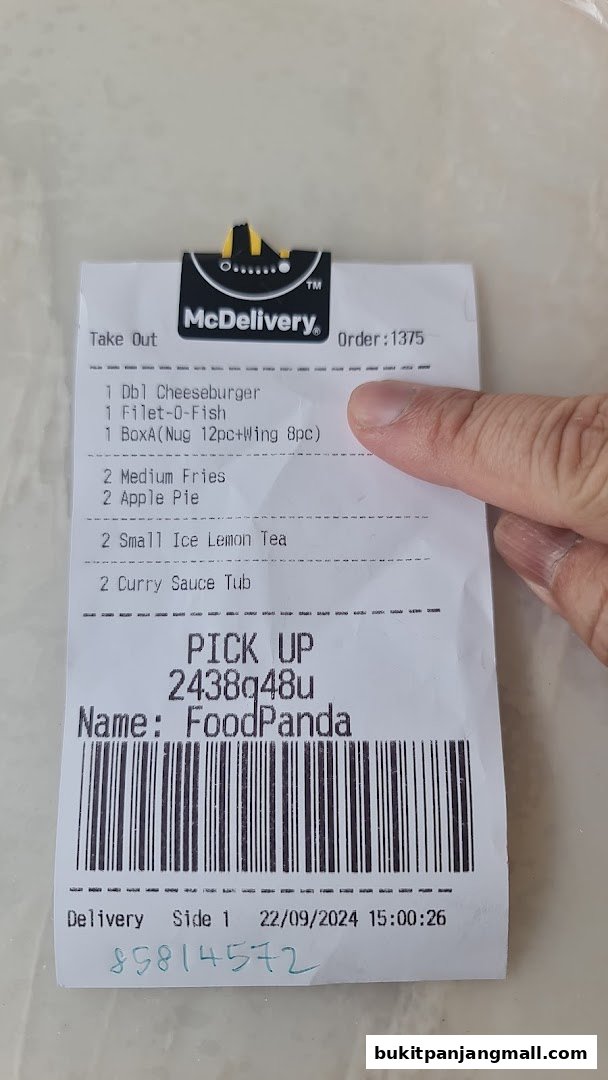 A McDonald's delivery receipt showing a list of food and drinks ordered.