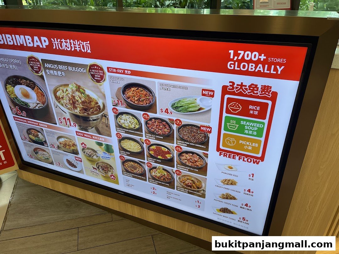 A digital menu board displaying various Bibimbap dishes and side options.
