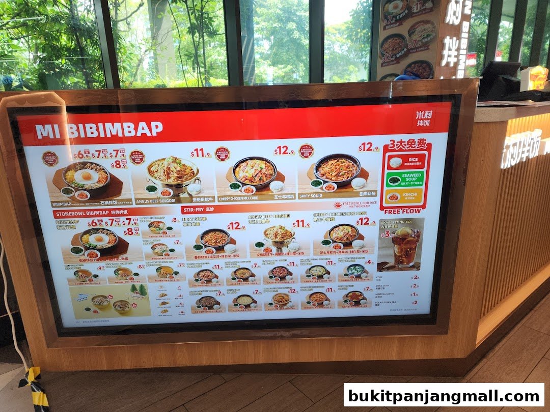 A digital menu board displays various Korean dishes with prices and images.