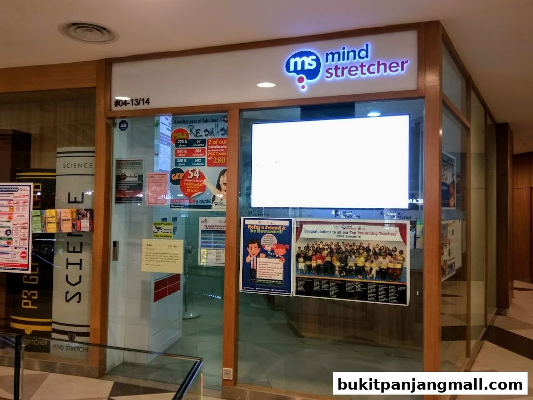 The entrance of the Mind Stretcher education center with posters and signage.