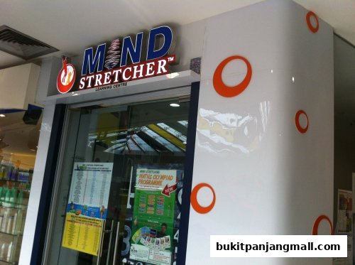 The entrance of Mind Stretcher Learning Centre with its prominent signage and promotional posters.
