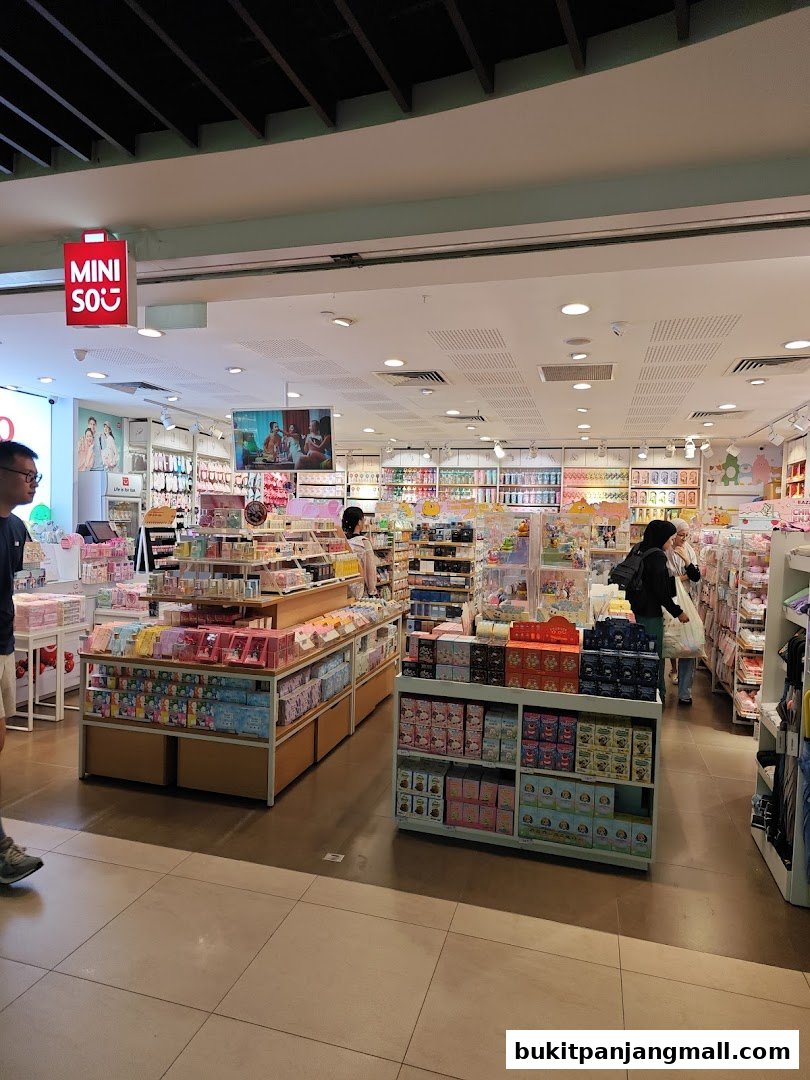 Interior view of a Miniso store filled with various colorful products and displays.