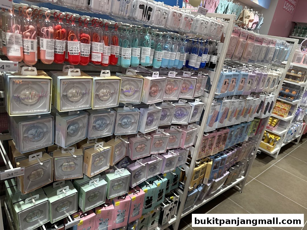 Shelves stocked with colorful earphones, power banks, and other accessories in a retail store.
