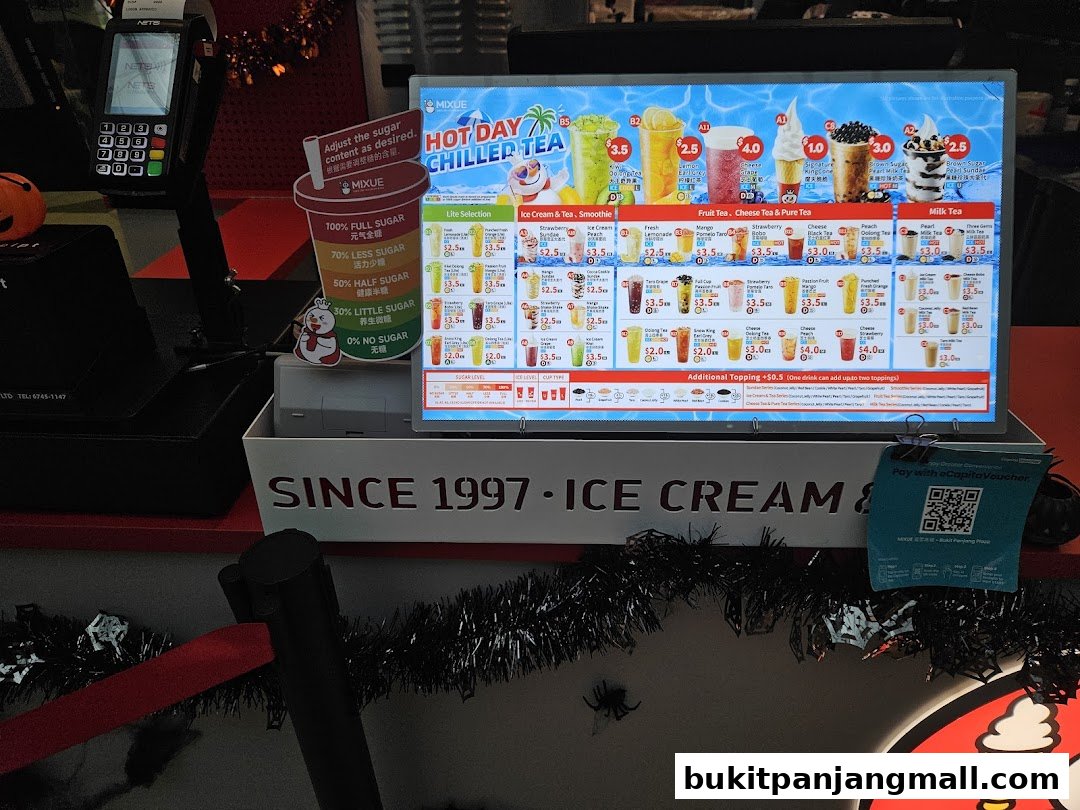 A digital menu board displaying various ice cream and tea beverages with prices.