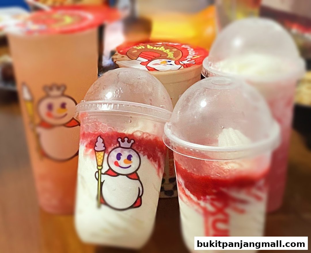 Several cups of colorful beverages with the MIXUE snowman logo are displayed.