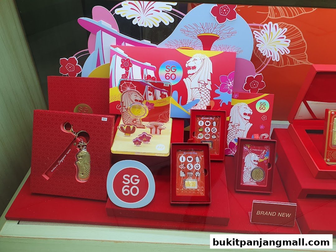 A display of Singapore-themed merchandise, including gold coins and keychains, in red packaging.