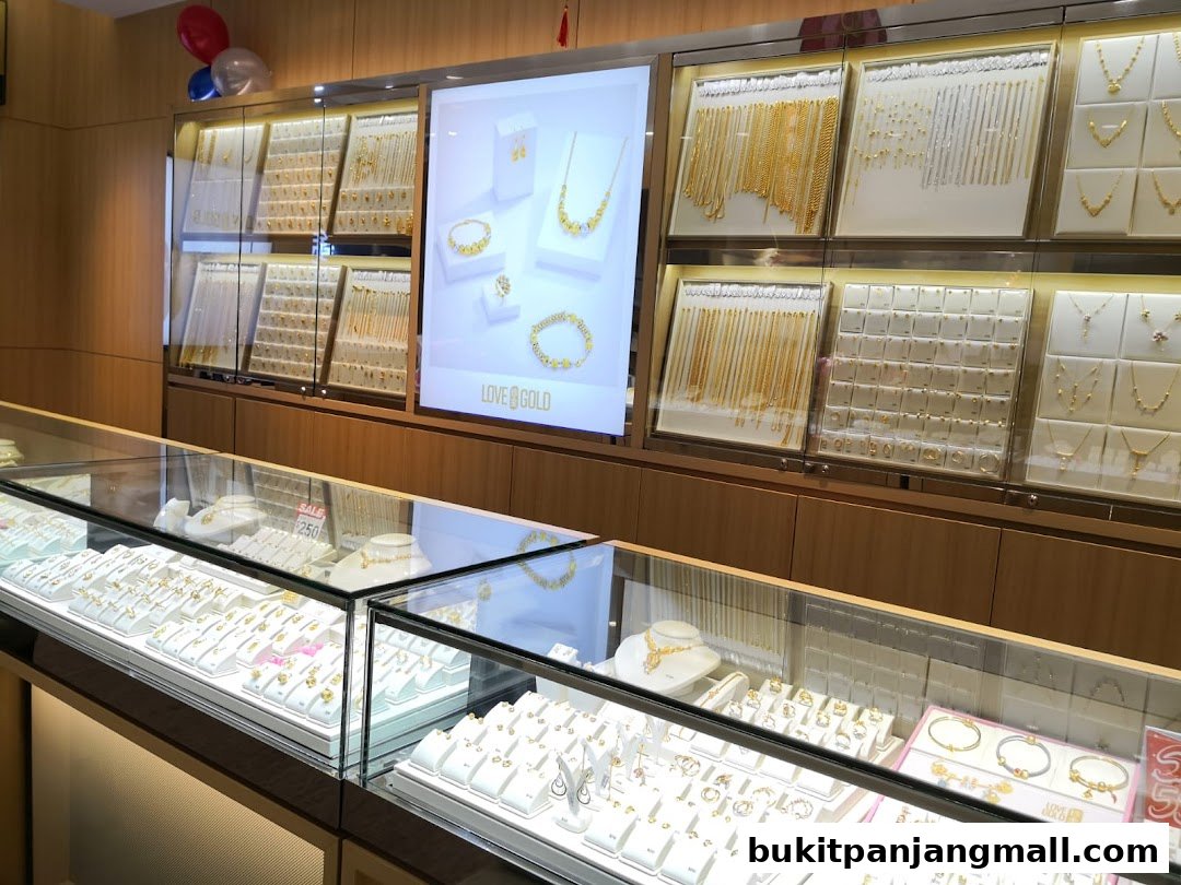 A jewelry store display featuring numerous gold necklaces, bracelets, and earrings.