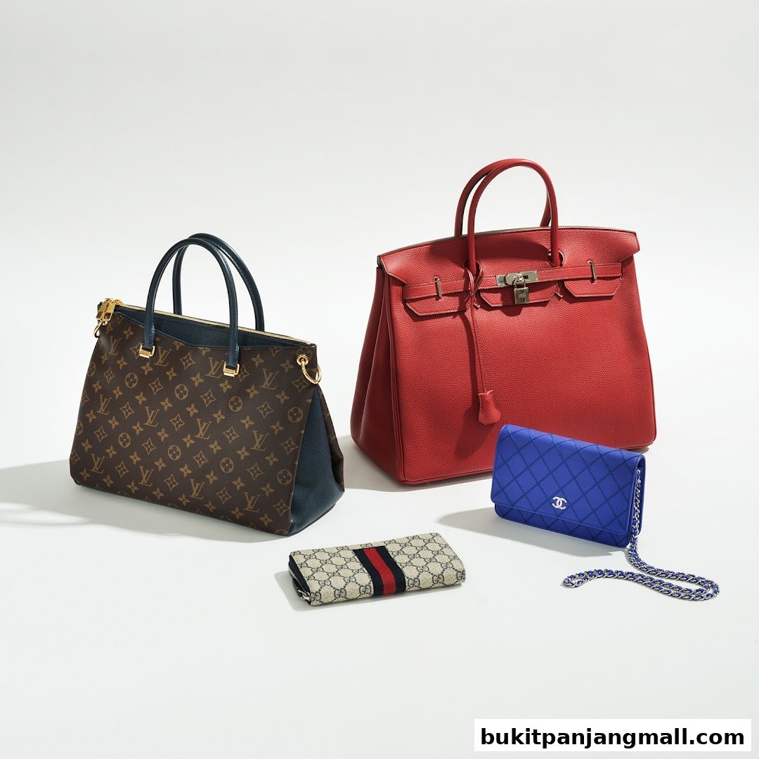 A collection of luxury handbags and wallets from designer brands on a white background.