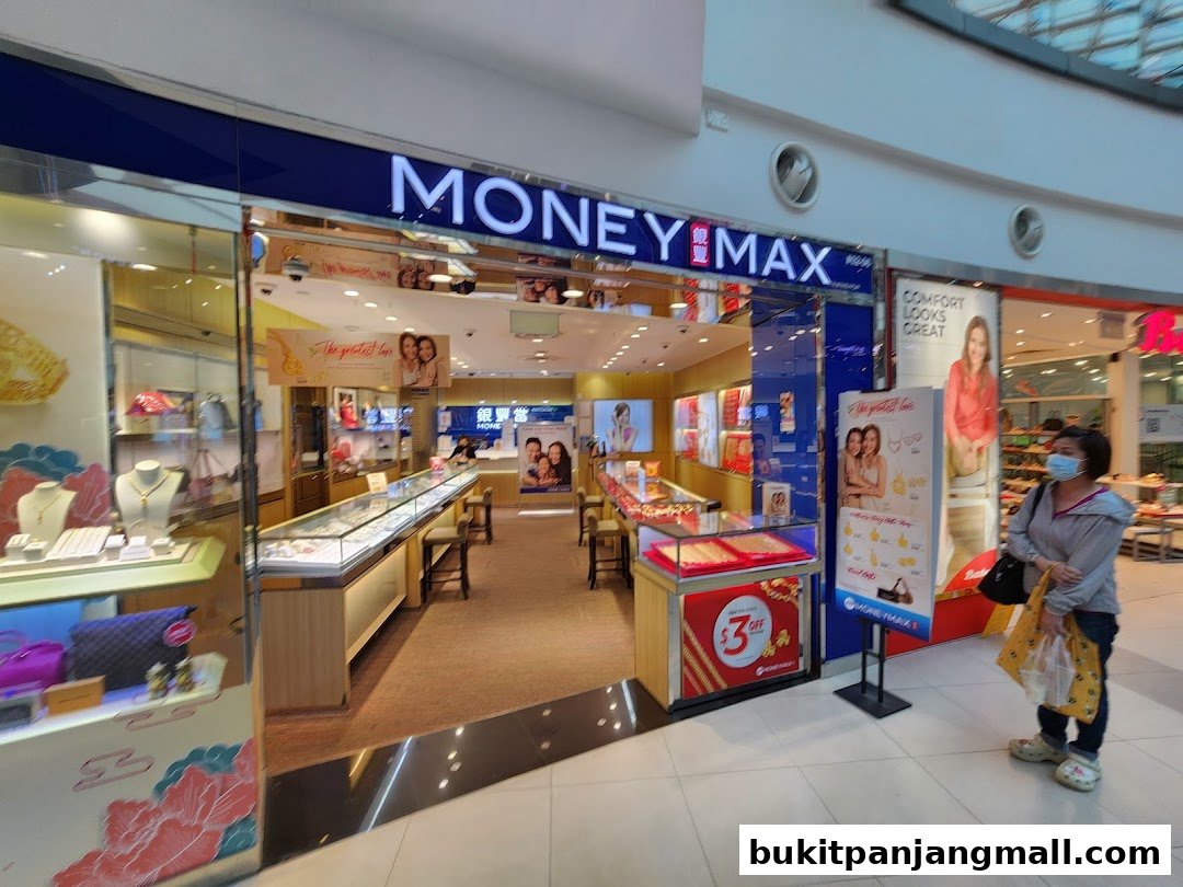MoneyMax Pawnshop storefront with jewelry displays and promotional signage.