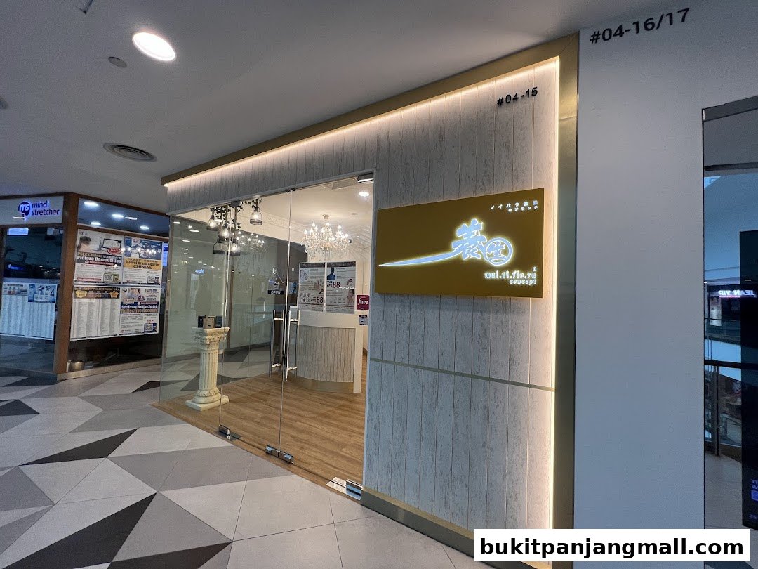 The entrance of Multiflora TCM Spa, featuring a modern design with glass doors and elegant signage.