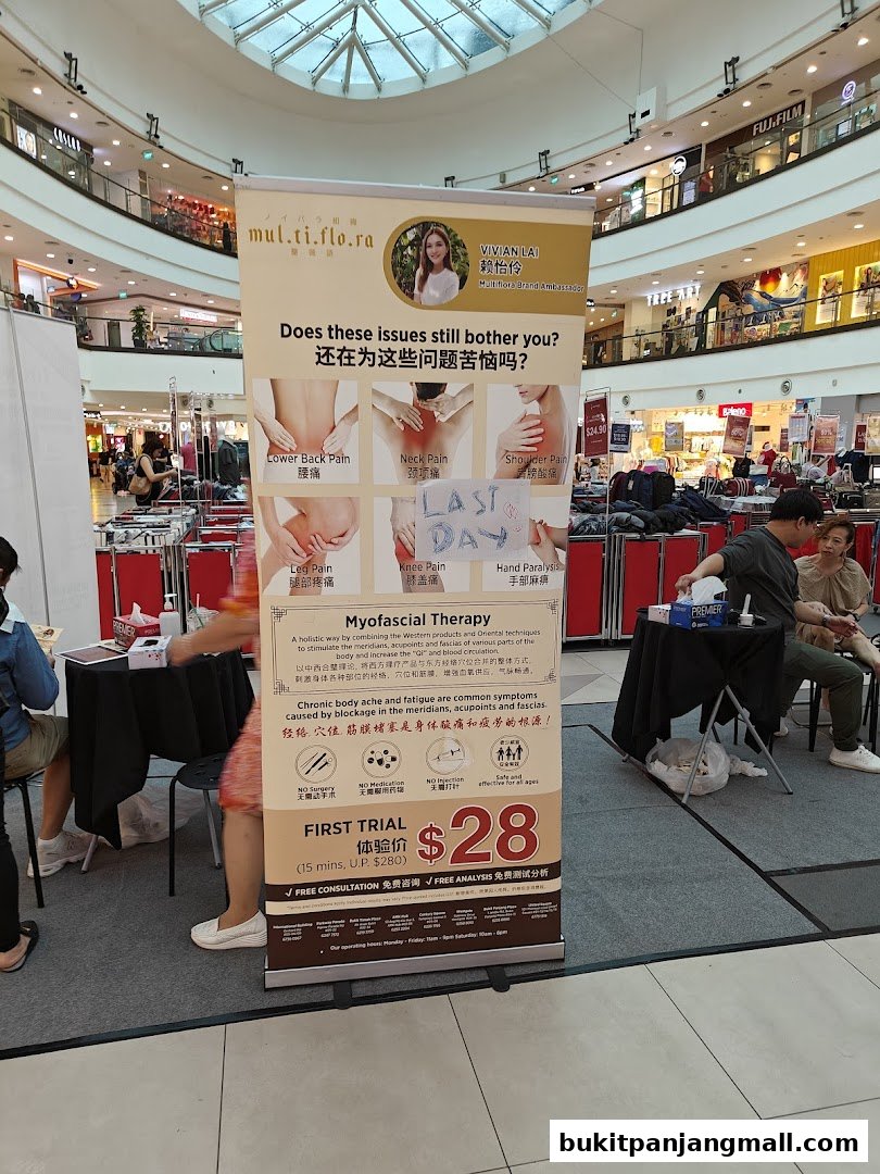 A promotional banner for Multiflora TCM Spa offering Myofascial Therapy for pain relief.