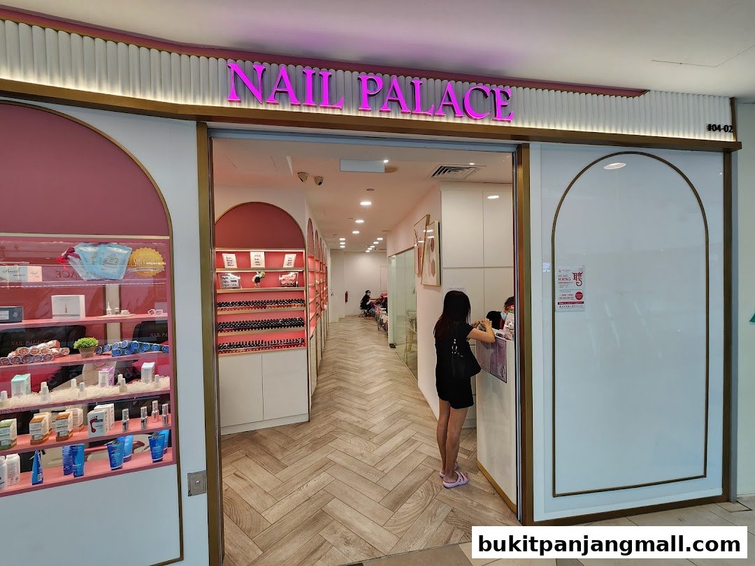 The entrance of Nail Palace, showcasing nail polish displays and a retail section.