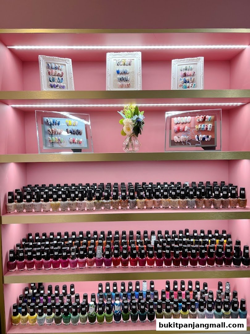 Shelves filled with various nail polish bottles and framed nail art displays.