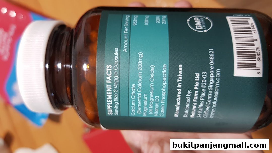 A close-up of a Nature's Farm supplement bottle showing the supplement facts label.