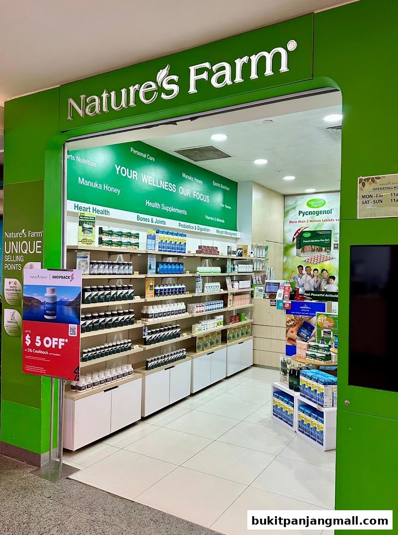 The entrance of Nature's Farm, a health supplement store, showcasing various products and promotions.