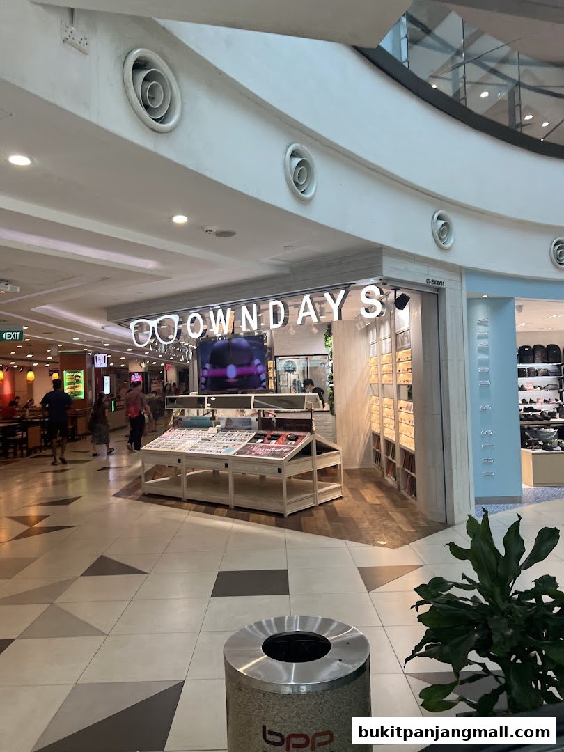 The exterior of an optical shop with a display of eyeglasses and a sign that reads 'OWNDAYS'.