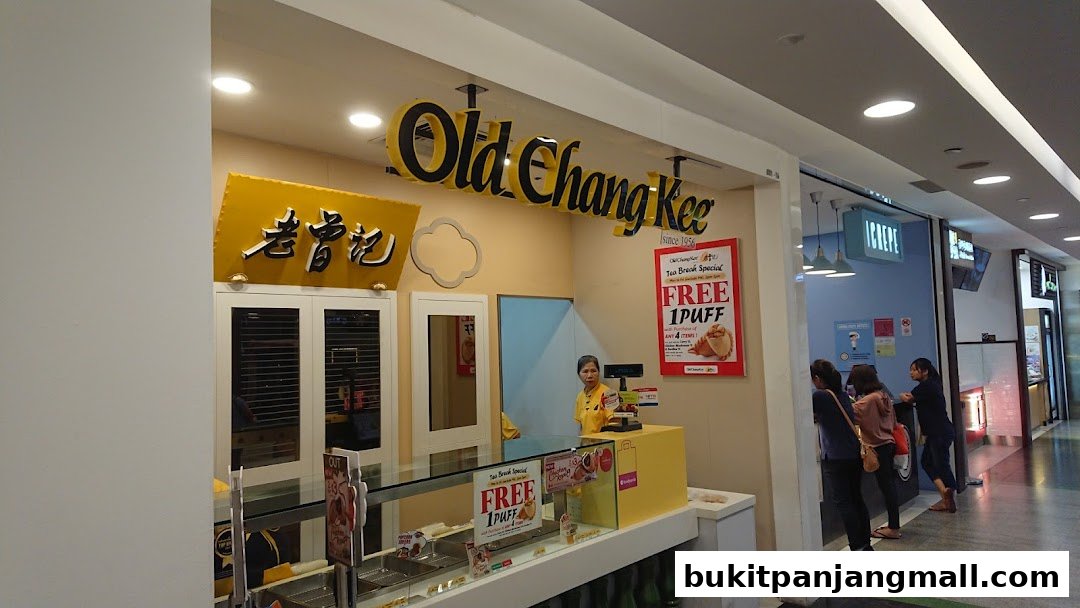 The Old Chang Kee shop front with its iconic signage and a special offer displayed.