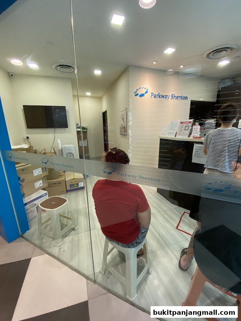 Interior view of Parkway Shenton medical clinic with patients waiting.