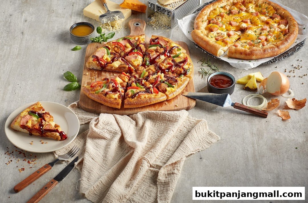 Two delicious pizzas, one with chicken and BBQ sauce, the other with pineapple and ham.