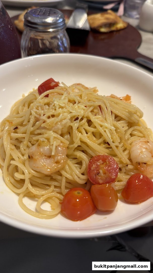 A close-up of a delicious shrimp and tomato pasta dish, garnished with cheese.