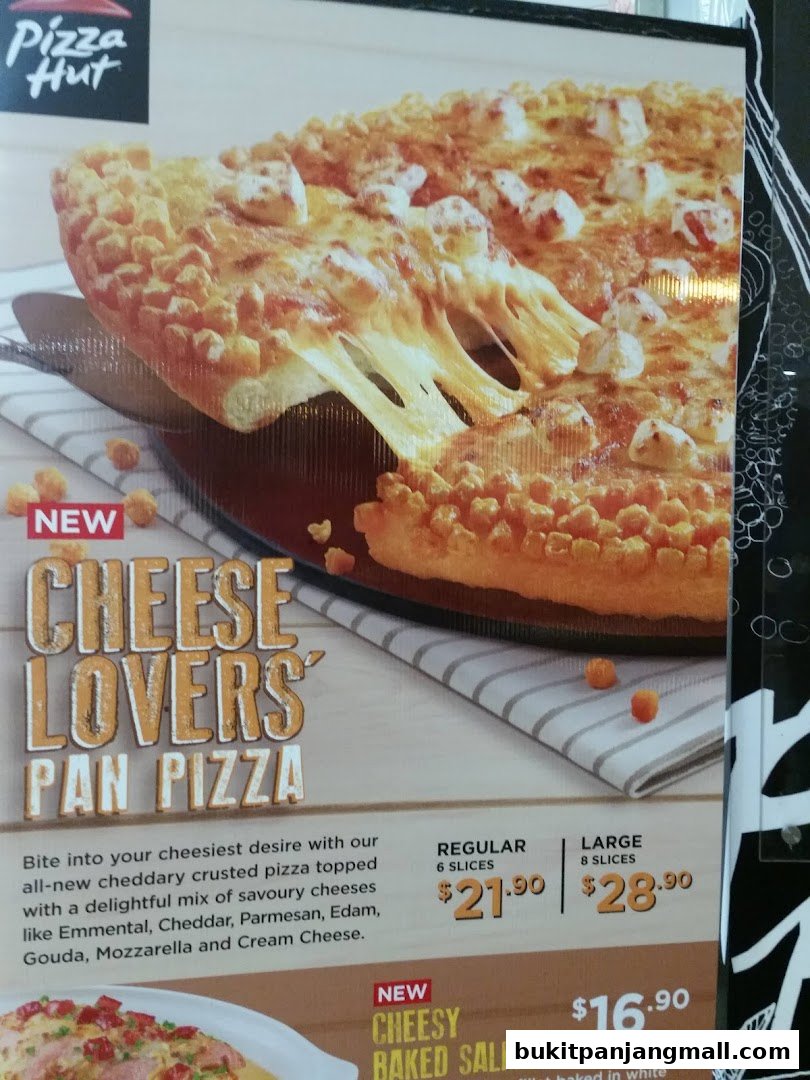 A Pizza Hut advertisement showcasing their new Cheese Lovers Pan Pizza and Cheesy Baked Salmon.
